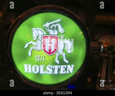 Kiel, Germany - 05. November 2025: Holsten beer tap handle showing the brand logo with knight and horse Stock Photo