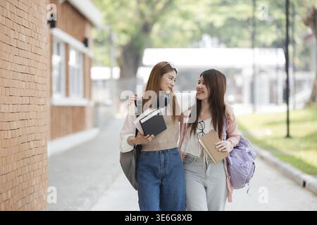 Group of young Asian college students are studying together in university. Students outdoors. Education concept Stock Photo