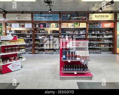 Keflavik, Iceland 23. June 2024, Various bottles of wine, spirits, and other alcoholic drinks are neatly arranged on shelves and promotional displays Stock Photo