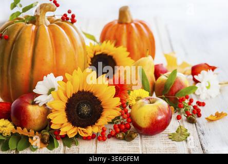 Autumn still life with seasonal fruits, vegetables and flowers Stock Photo
