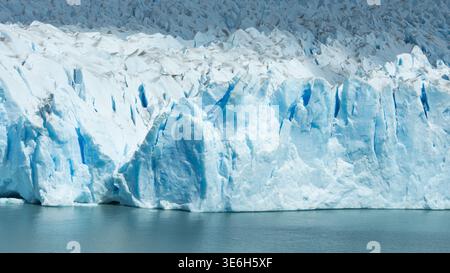 Detailed close-up of Perito Moreno Glacier showing sharp blue ice formations, crevasses and textured frozen surface in Patagonia, Argentina Stock Photo