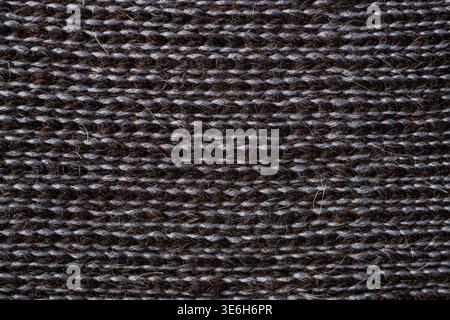 Dark alpaca wool knitted textile macro texture natural fiber background Stock Photo