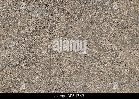 Detailed texture of flat gray pebble dash plaster wall Stock Photo