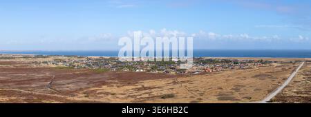 Aerial view of holiday homes and village of Nørre Lyngvig with Ringkøbing inlet in background. Danish North Sea coast landacape panorama. Stock Photo