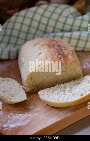 Freshly baked homemade bread on a rustic wooden background Stock Photo