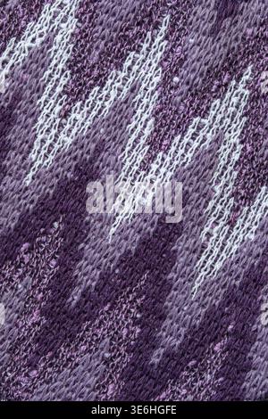 Purple abstract pattern knit fabric background closeup Stock Photo