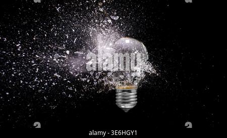 Light bulb real exploding dark background Stock Photo