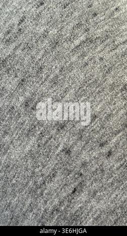 Gray fabric texture with subtle thread pattern ideal for use as a textile background. Mobile photo Stock Photo