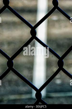 An interlinking diamond shaped metal fence Stock Photo