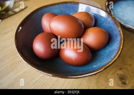 Boiled eggs, the shell color obtained after boiling in onion skins. Easter. Stock Photo