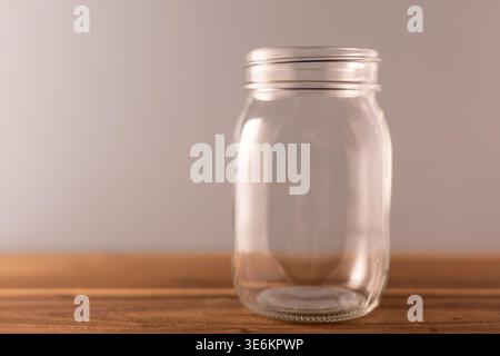 Empty Glass Jar on Wooden Surface with Copy Space – Studio Studio Shot - part of sequence Stock Photo