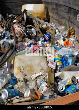 Horwich, Bolton, UK, 06 April 2026: Mixed pile of plastic bottles, aluminum cans and other discarded trash piled outdoors, highlighting pollution, non Stock Photo