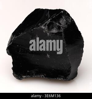 High resolution studio shot of a natural volcanic glass obsidian stone for healing and decoration Stock Photo