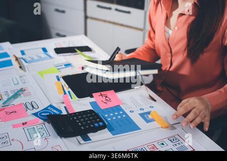 team of UI UX web designer are working together to develop mobile responsive websites with UI UX front end designer previews Stock Photo