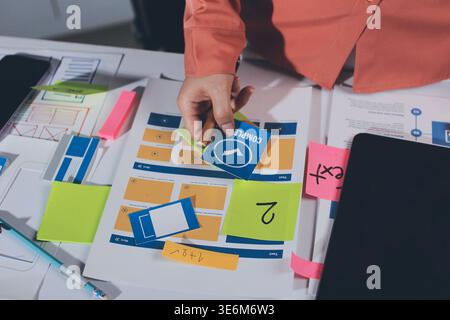 team of UI UX web designer are working together to develop mobile responsive websites with UI UX front end designer previews Stock Photo
