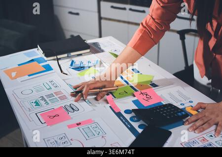 team of UI UX web designer are working together to develop mobile responsive websites with UI UX front end designer previews Stock Photo