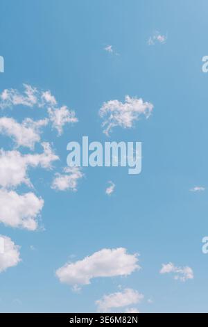 Sky With Clouds. Serene Azure Sky Filled With Drifting Fluffy Clouds Stock Photo