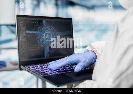 Using AI neural network, laptop closeup and engineer in microchip factory visualizing machinery sensors data. Using machine learning algorithms, industry 4.0 and technician in PCB manufacturing plant Stock Photo
