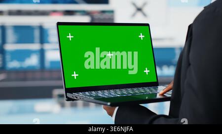 Isolated screen laptop software used by business professional to analyze performance dashboards metrics. Person evaluating annual report data KPIs using mockup digital device, close up shot Stock Photo