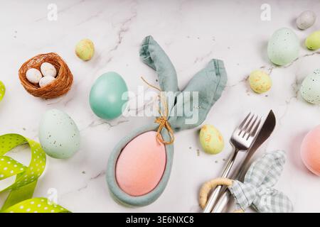 Creative Easter Composition with Decorated Eggs and Bunny Napkin Stock Photo