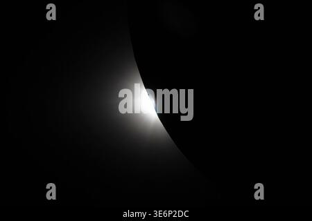 End of total solar eclipse as sunlight reemerges from behind the Moon, bright sliver along lunar limb, Artemis II lunar flyby, April 6, 2026, NASA Stock Photo