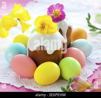 Food, Easter cake with glace icing and coloured easter eggs Stock Photo