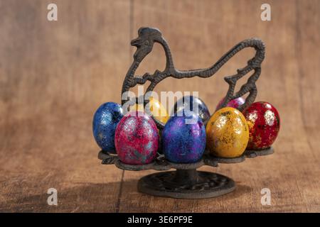 Colourful Easter eggs in a symbolized metal chicken as a stand, studio shot, Genthin, Saxony-Anhalt Stock Photo