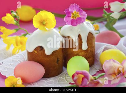 Food, Easter cake with glace icing and coloured easter eggs Stock Photo