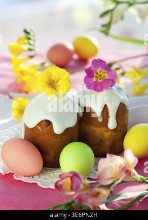 Food, Easter cake with glace icing and coloured easter eggs Stock Photo