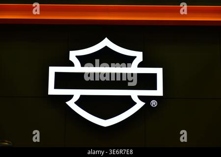 Thailand-March 26,2026:The iconic Harley-Davidson Bar and Shield logo displayed on a dark wall at an official motorcycle dealership at the 47 Bangkok Stock Photo