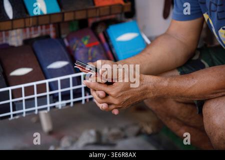 Male hands using smartphone, travel lifestyle and digital behavior, close up. Stock Photo