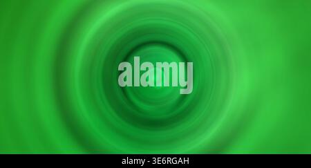 Graduating shades of green forming a radial motion blur with a central focus Stock Photo