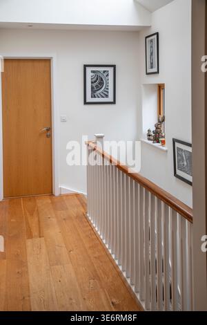 A wooden floored landing corridor in a modern house. Stock Photo