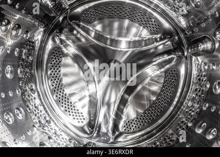 Washing machine drum showing shiny metallic surface Stock Photo