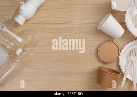Eco-friendly disposable tableware on wooden background Stock Photo
