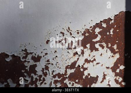 close up of painted metal surface. peeling paint Stock Photo