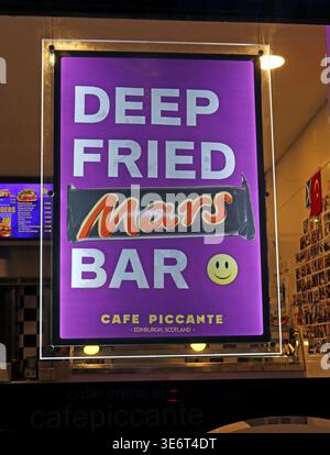 Deep Fried Mars Bar sign at Cafe Piccante in Edinburgh, Scotland, illustrating fried food culture, novelty takeaway food and public health debate. Stock Photo