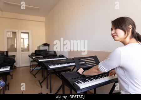 Music classroom with multiple instruments Stock Photo
