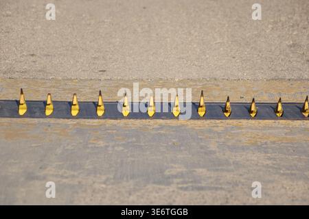 close up of spike road blocker barrier Stock Photo