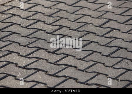 close up of gray concrete iclose up of gray concrete interlocking paver stonesnterlocking paver stones Stock Photo