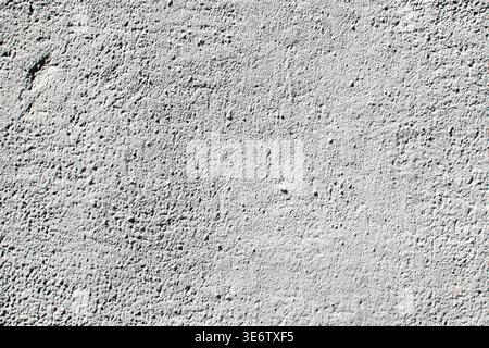 Light gray plaster wall texture with subtle rough surface and natural uneven pattern background Stock Photo