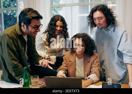 Collaborative Prototype Review Session, Group Engaged In Dynamic Feedback During Project Examination Stock Photo