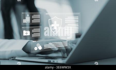 Health insurance online and medical records technology.Digital healthcare management system with laptop.Secure online medical data solution.Woman hand Stock Photo