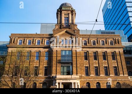 The historic MaRS Discovery District building with a central tower stands on College Street in Toronto, Ontario, Canada, April 26, 2023. MaRS Discover Stock Photo