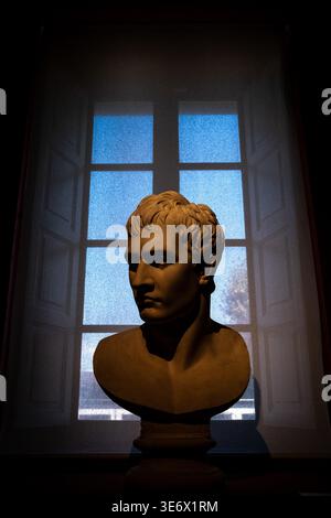 Bust portrait of Bonaparte by Antonio Canova is displayed in front of a large window at Musee Fesch in Ajaccio, Corsica, France, August 13, 2024. Muse Stock Photo