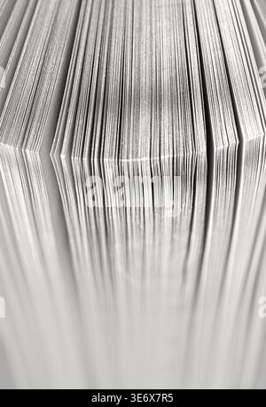 Book pages close-up creating vertical lines and a soft, textured background Stock Photo