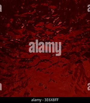 Dark red liquid surface ripples, creating an abstract background texture Stock Photo