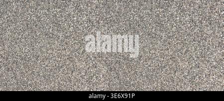 Gravel aggregate creating textured background showing many small gray stones Stock Photo