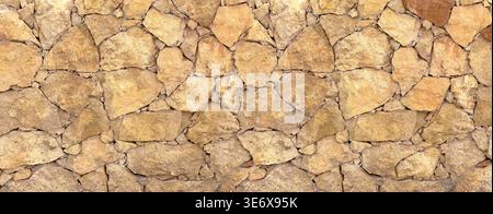 Rough stone wall featuring natural rocks creating a textured background Stock Photo