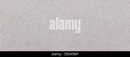 Rough gray wall surface creating an uneven texture background Stock Photo